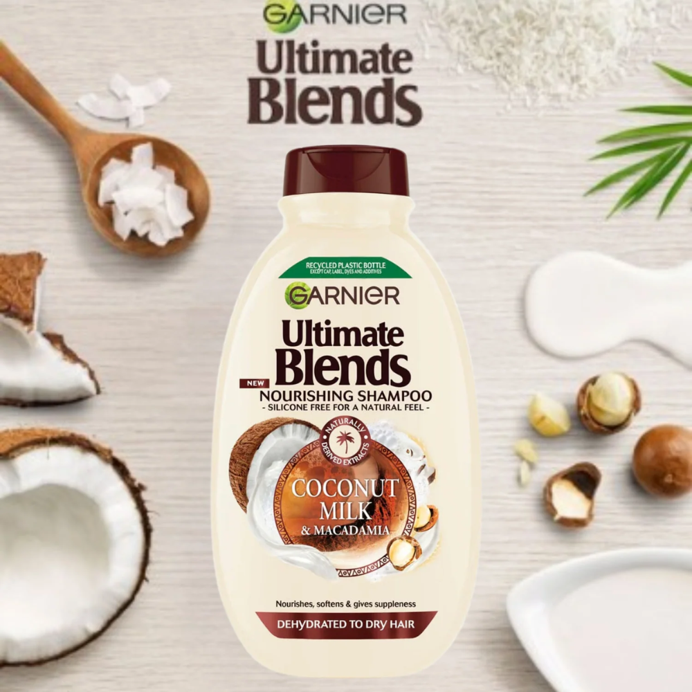 Garnier Ultra Blends Coconut Milk shampoo bottle for hair care, 400ml with a coconut and milk-themed label.