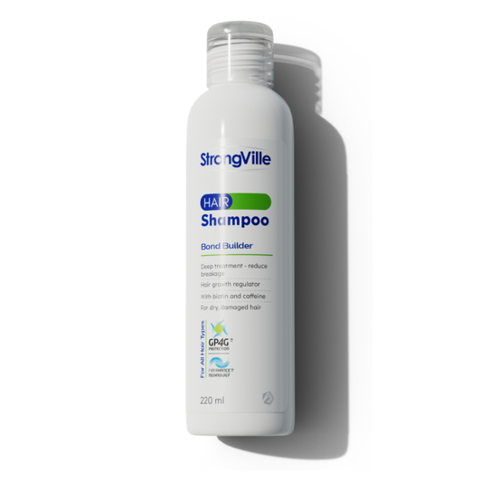 Strongville Extra Hair Shampoo 220 ml bottle with clear label, designed for nourishing hair care.